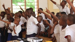 Many students raising their hands