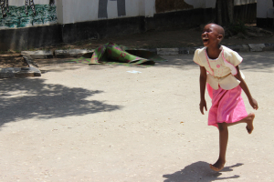 Angel running with a big smile