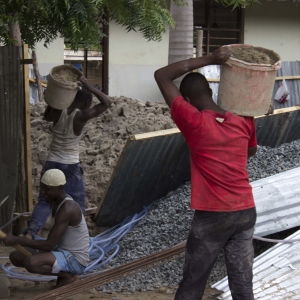 Construction crew works with their hands to accomplish the difficult job